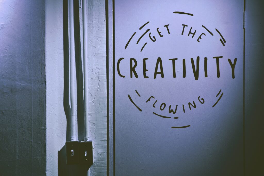 A door with the words "get the creativity flowing" to help create quality content