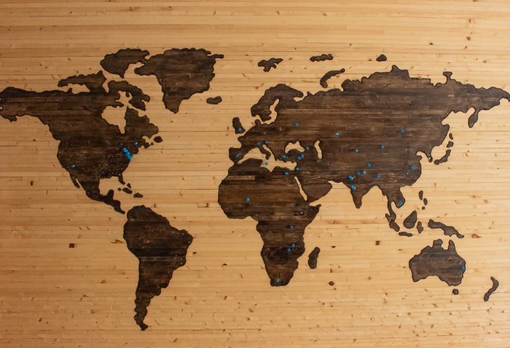 World map image with blue tacks