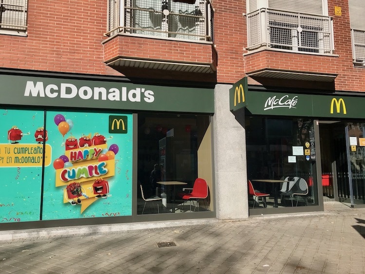 Madrid McDonalds showing that the brand uses green and yellow signage to promote a more eco-friendly brand image