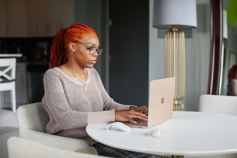 Woman working on her computer doing focused work