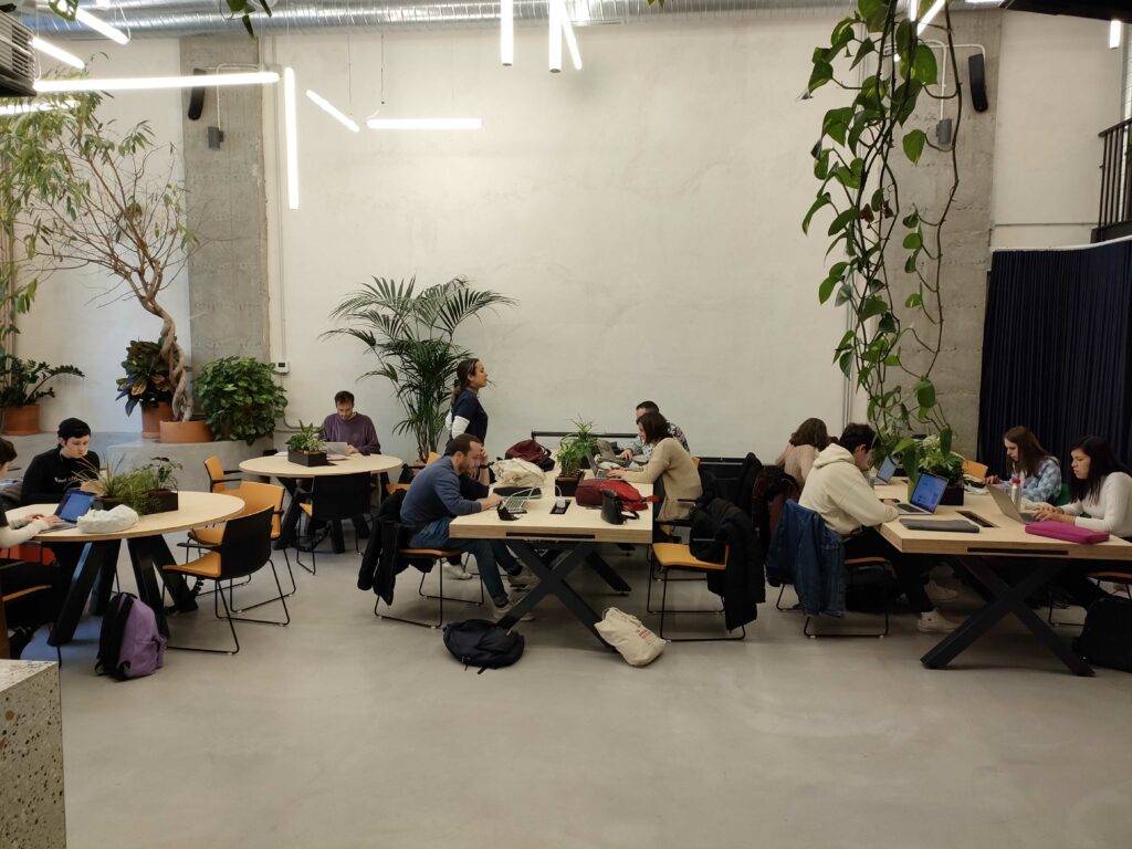 The VeraContent team working at a coworking space in Madrid