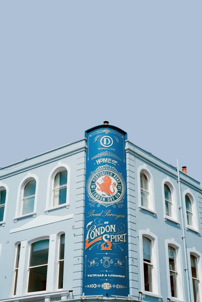 A culturally localized advert for a gin brand shown on Portobello Road in London