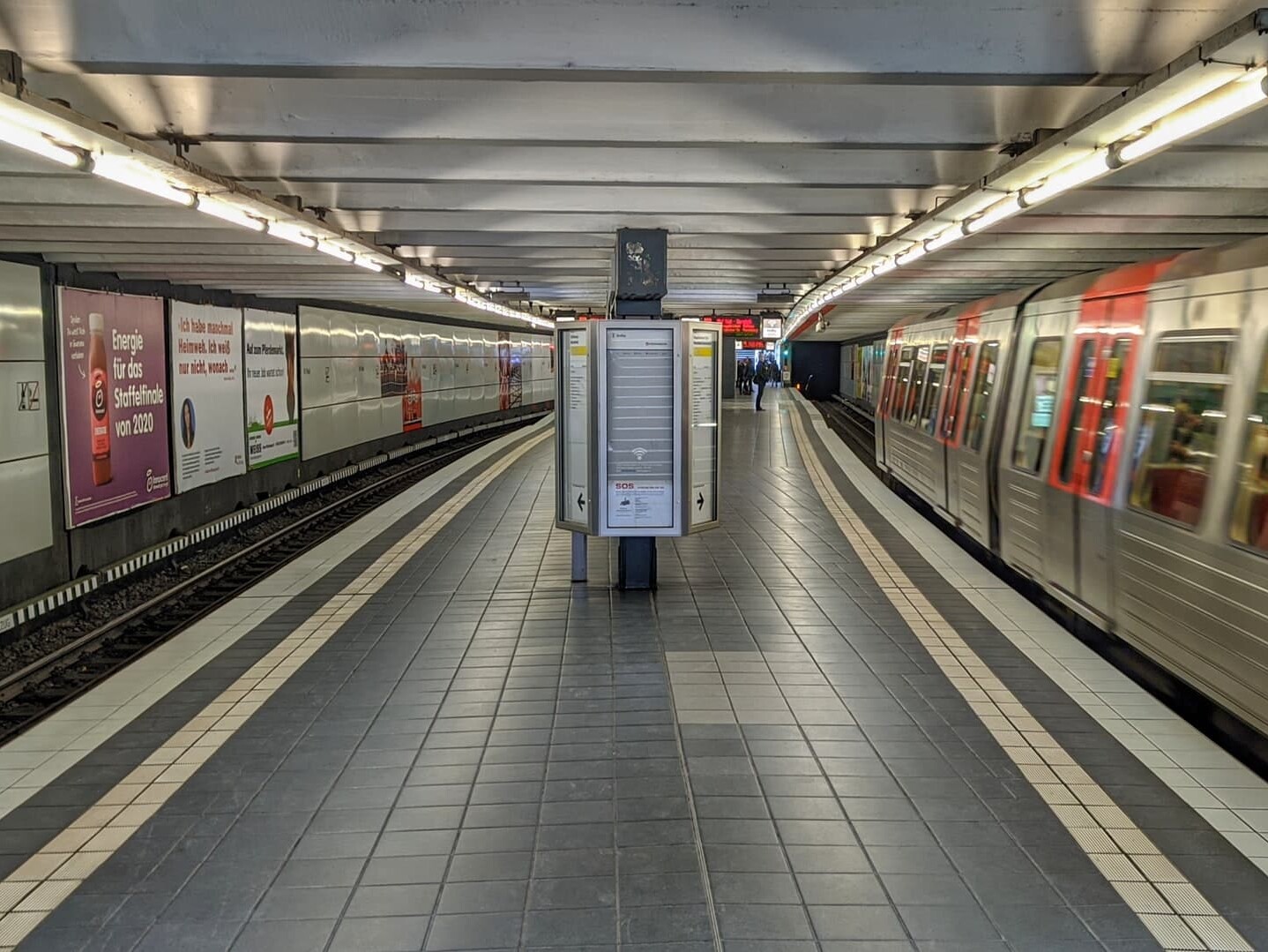 An image of adverts the walls of a train station highlighting the importance of cultural marketing