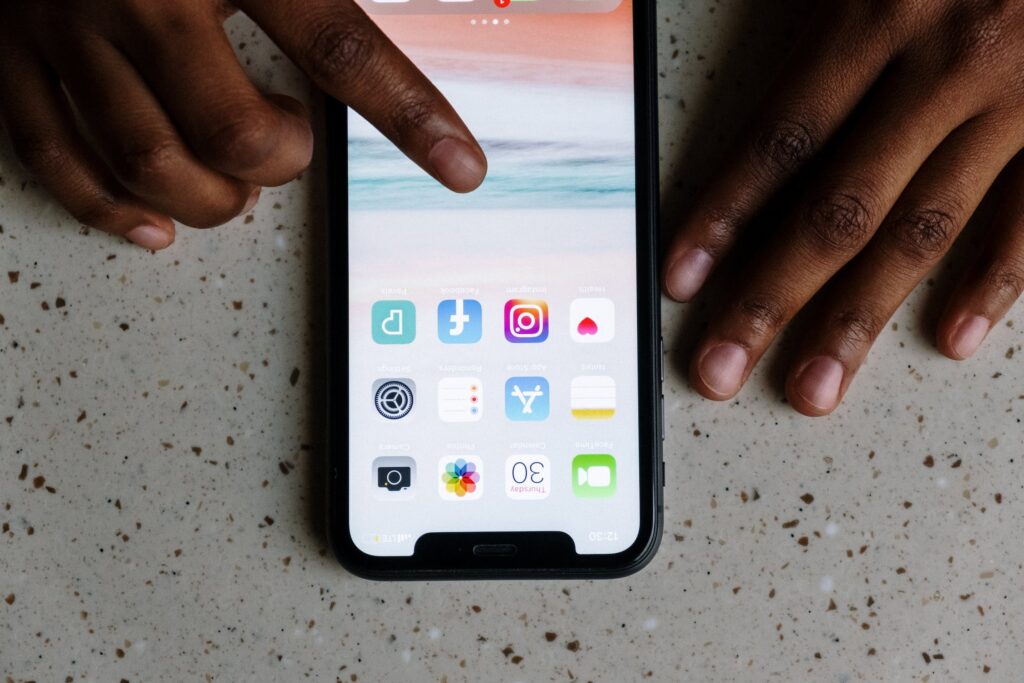 A person browsing through different social media apps that offer language translations