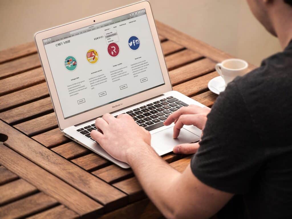 A man working on multilingual content on his laptop