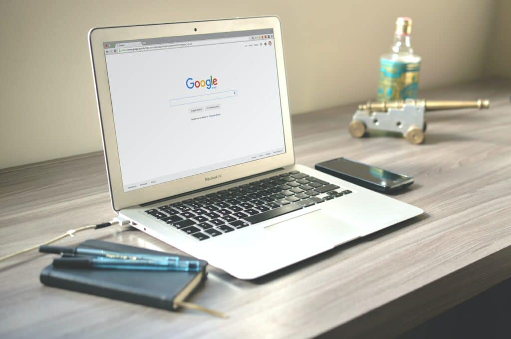 Laptop on table showing Google