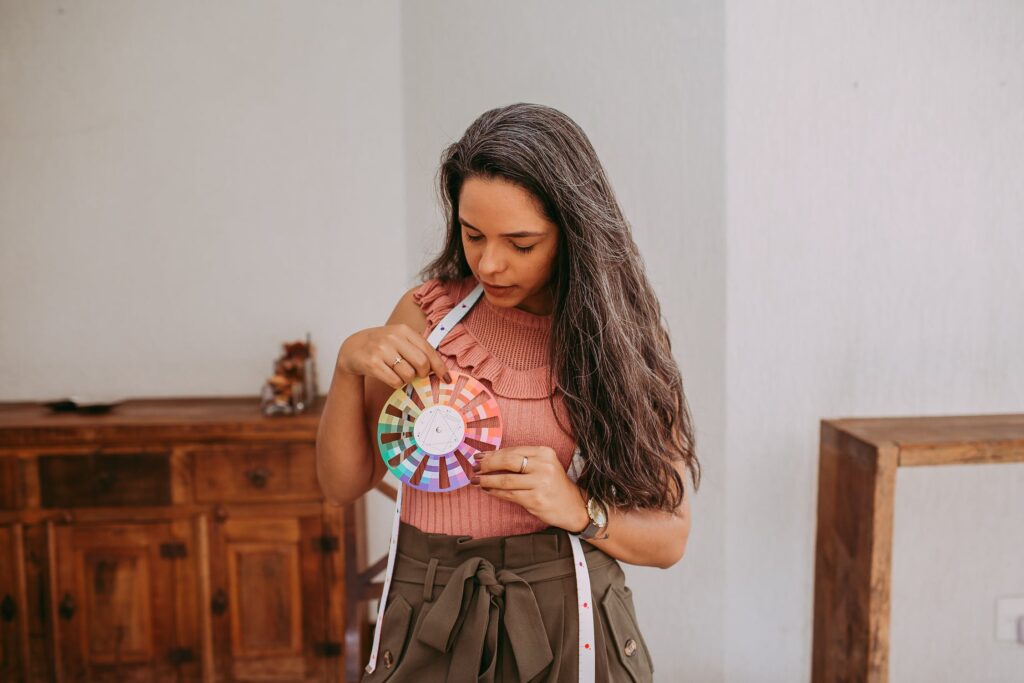 A global marketing specialist holding a color wheel