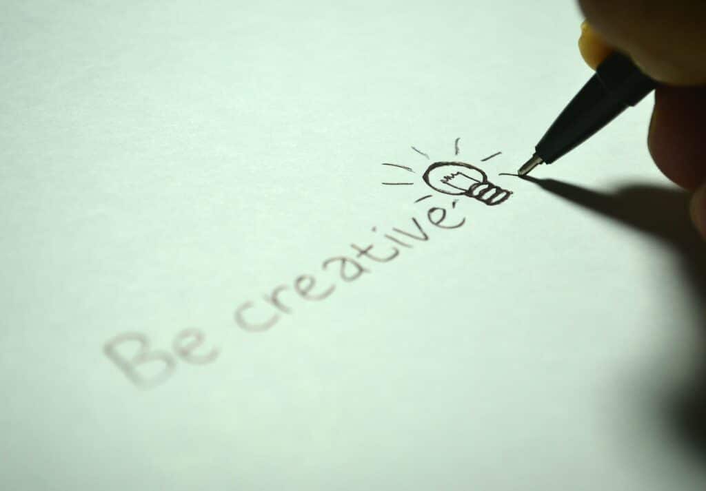 “Be creative” written on a piece of paper