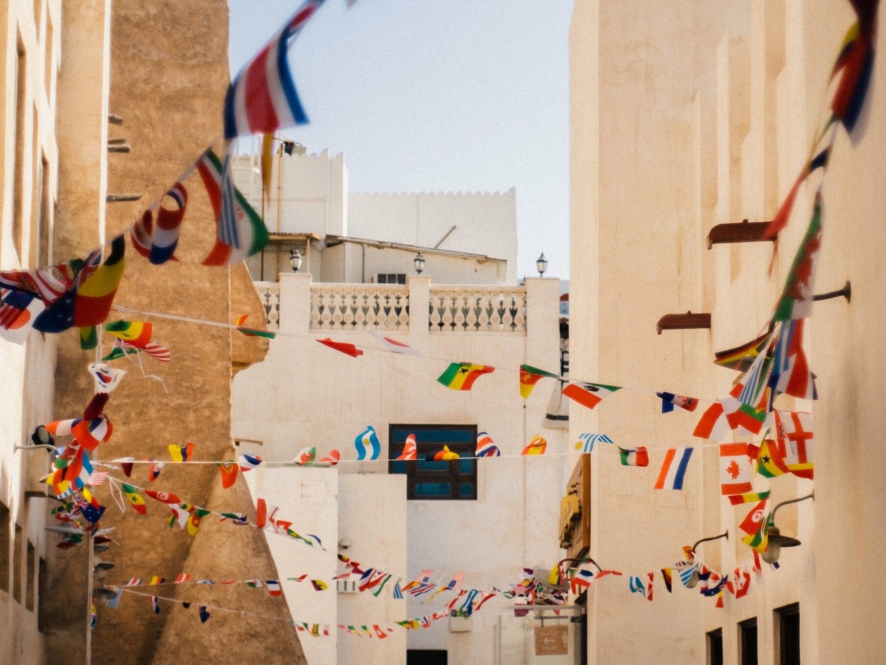 A street with multiple flags of the world