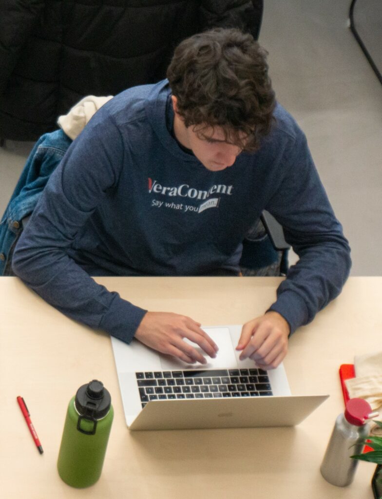 VeraContent team member translating content marketing on his laptop