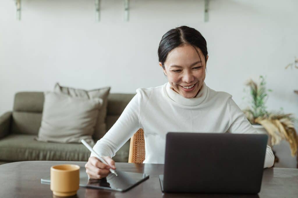 professional translator smiling at her computer