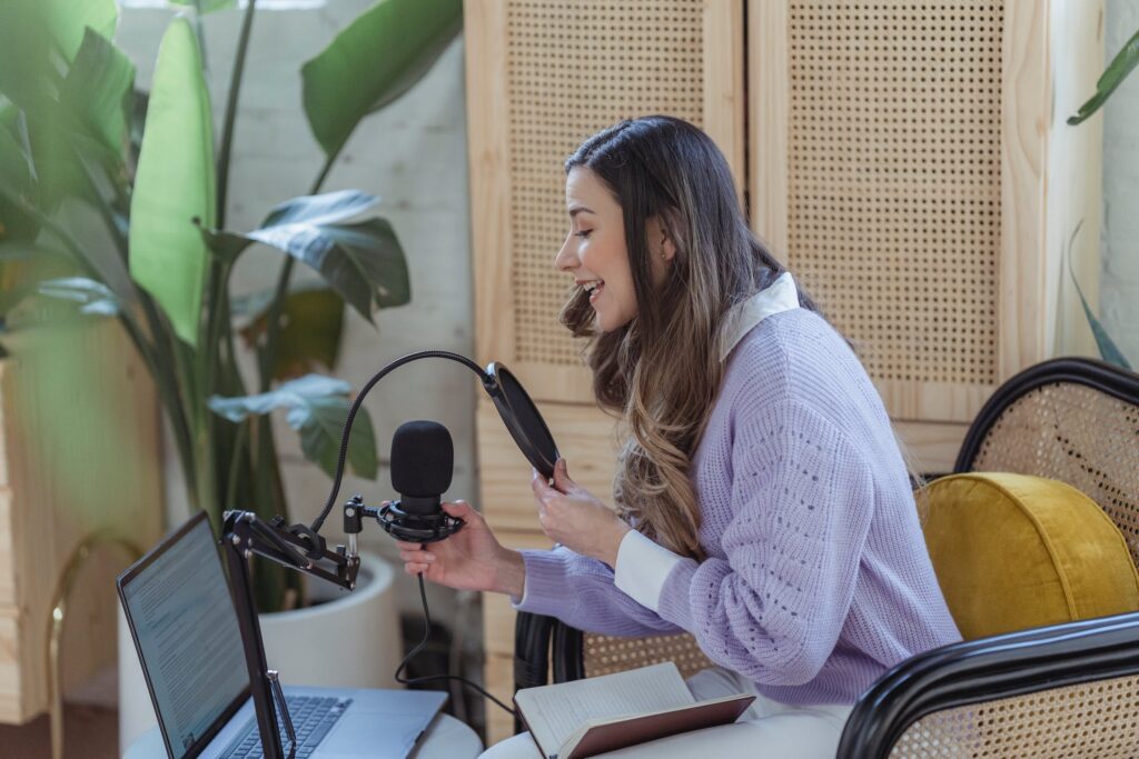 woman speaking into a microphone