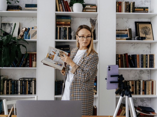 Woman creating a LinkedIn vertical video in her home