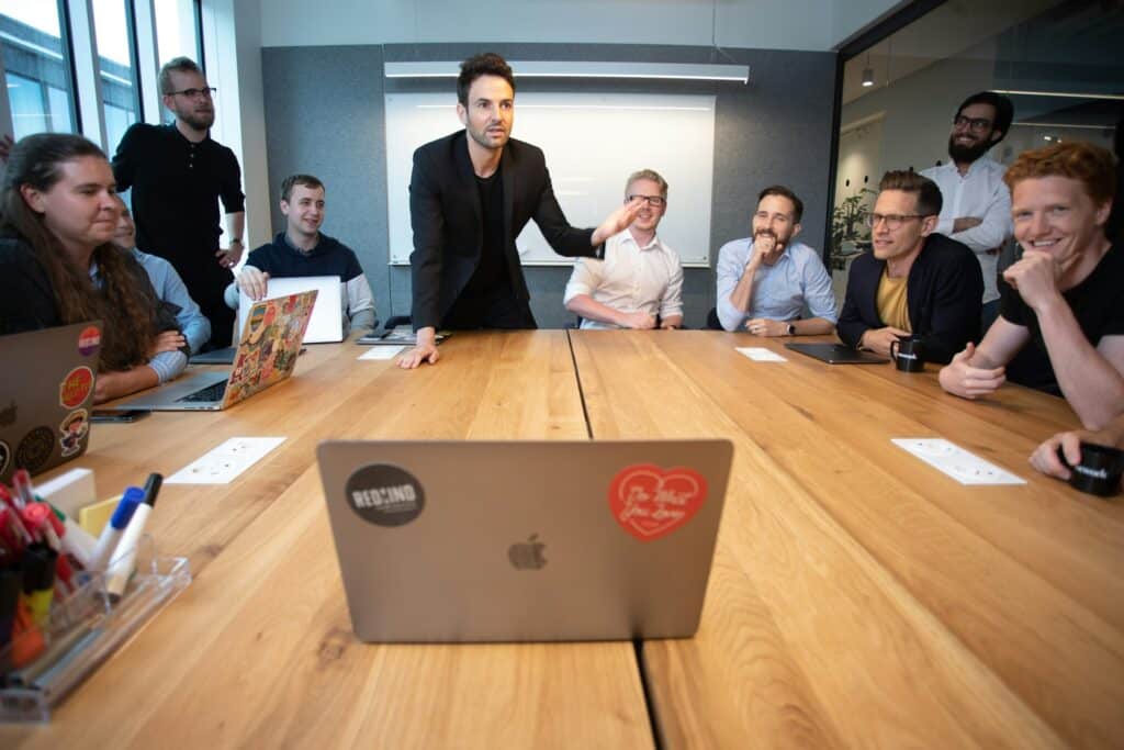 Global marketing team sitting around a large table