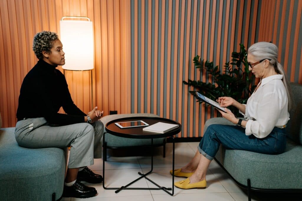 An employee interviewing a marketing translator