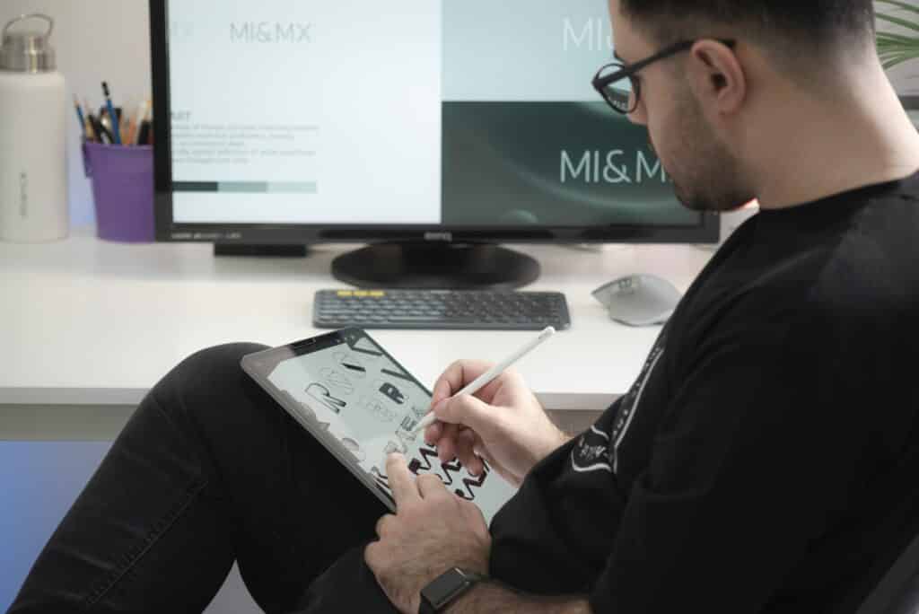 A designer working on different multilingual graphic designs