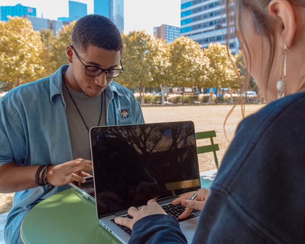 Standard Spanish translators working on laptops