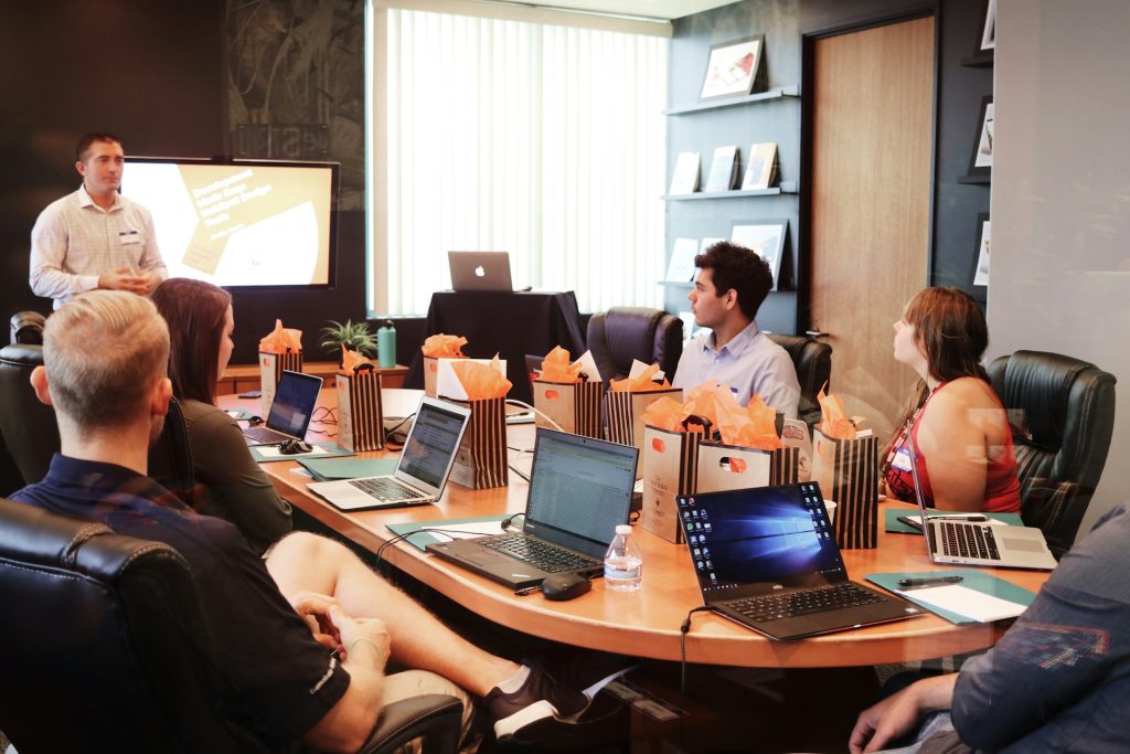 Global marketing team setting around a boardroom table