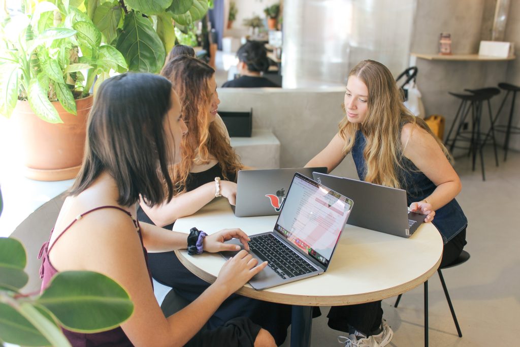 VeraContent team members working around a desk